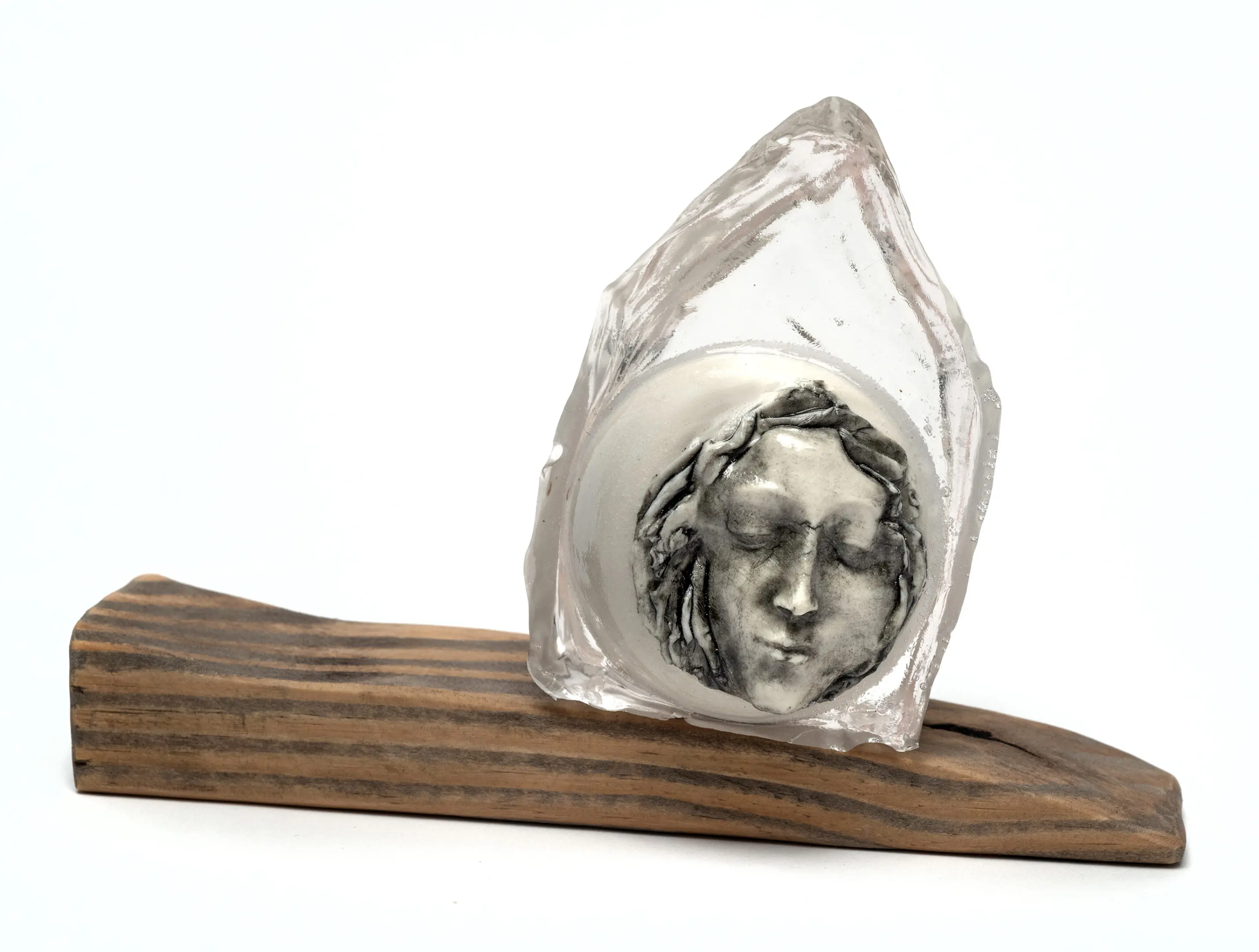 Mixed media sculpture of simplified house with abstracted female figure