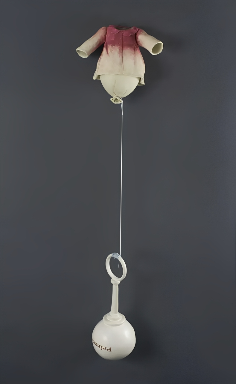 Ceramic Sculpture of empty children's clothing with preparatory toys