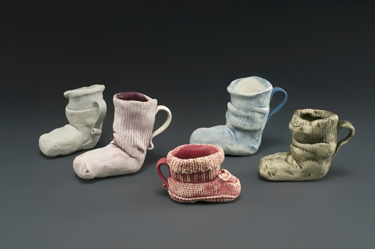 Sock-shaped ceramic mugs in various colors